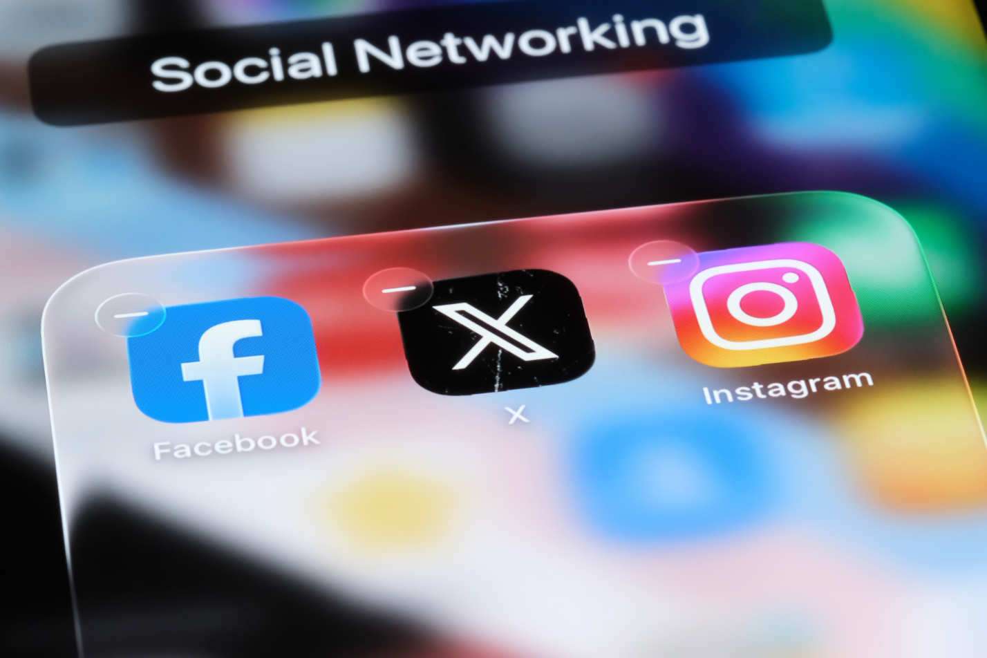 Smartphone displaying the X social media interface with engagement icons.